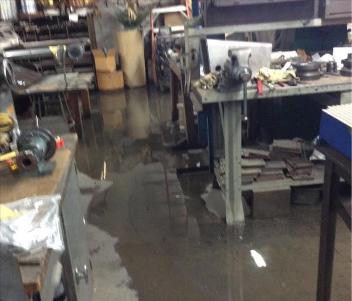 Flooded unit of a commercial building, with standing black water